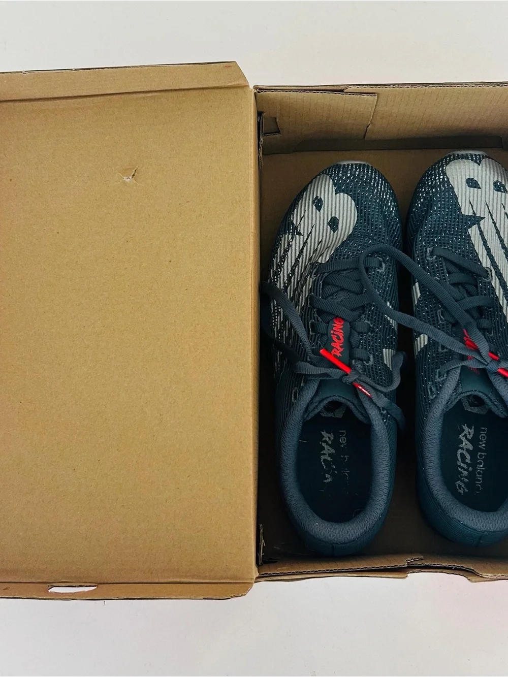New Balance Men's Racing Shoes in Charcoal Gray with White and Red Accents